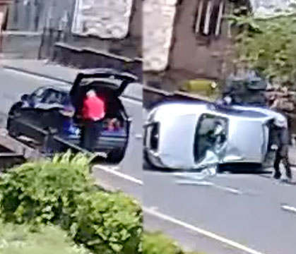 How TF Did They Not See Dude? Apparently Wearing A Red Shirt & Standing In Front Of A Car Isn't Enough To Be Visible To Some!